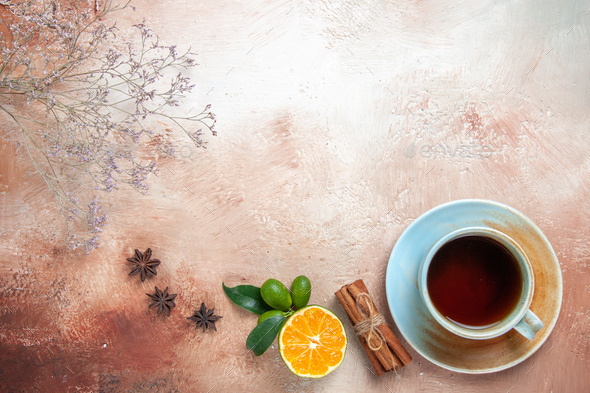 top view cup of tea with cinnamon and lemon on light background tea color  ceremony Stock Photo by KamranAydinovStudio