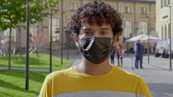 Young man wearing protective face mask.