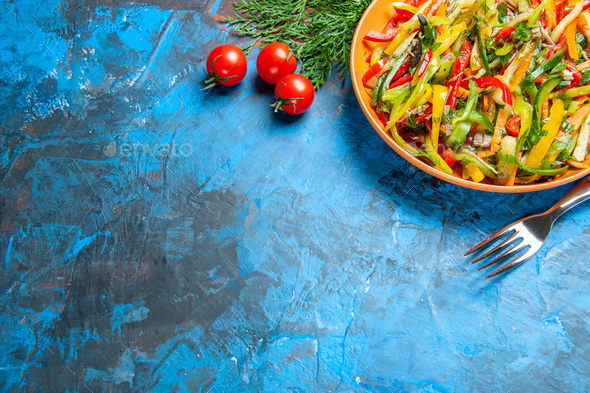 top view tasty vegetable salad inside plate on blue background food photo  health salad diet color Stock Photo by KamranAydinovStudio