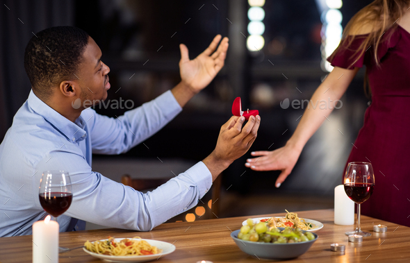 Proposal Rejection. Woman Leaving Black Boyfriend In Restaurant After He Proposed Marriage