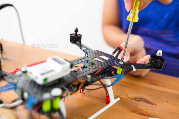 Connecting the component on drone - Stock Photo - Images
