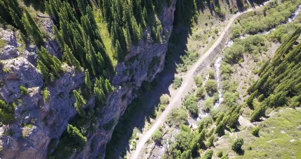Top View of the Cave, Forest, Rocks and Road. alt