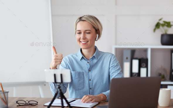 Online tutoring. Professional tutor having video call with students, gesturing thumb up, giving