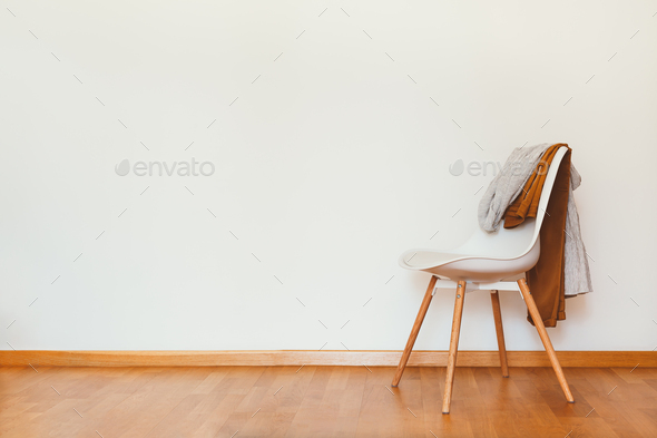 Indoors flat wall mockup with Clothes on Chair