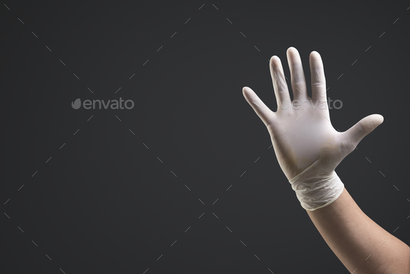 Hands wearing medical gloves using invisible screen - Stock Photo - Images