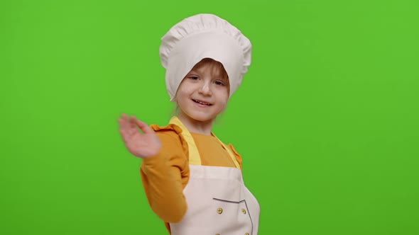 Funny Child Girl Kid Dressed Cook Chef Baker in Apron and Hat Dancing Fooling Around Making Faces alt