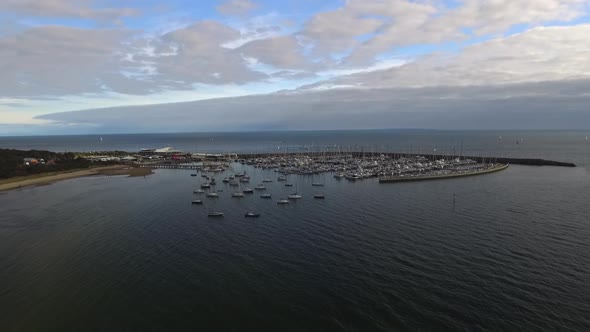 Drone aerial view of Port Phillip Bay in Hampton, Melbourne Australia. Day time clouds in sky. alt