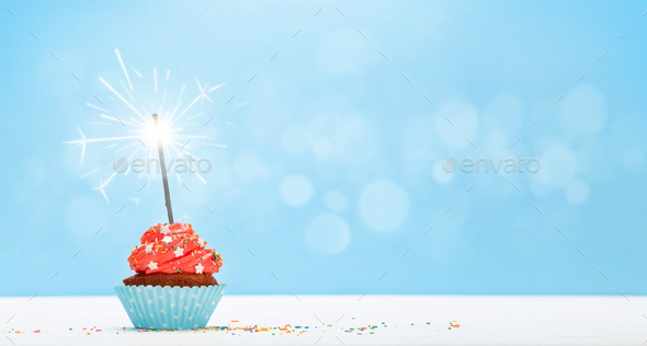 Birthday cupcake with burning sparkler