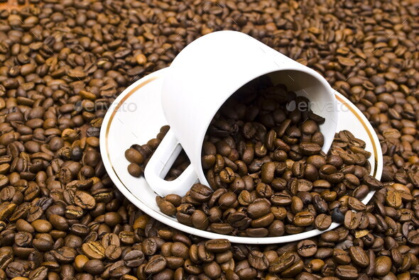 Cup of coffee in the coffee beans - Stock Photo - Images