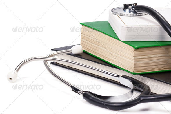old books and black stethoscope isolated on white - Stock Photo - Images