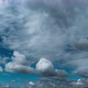 White Fluffy Clouds Slowly Float Through the Blue Daytime Sky Timelapse - VideoHive Item for Sale