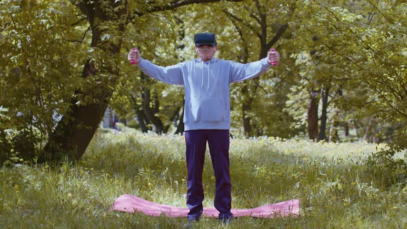 Senior Man Exercising Making Dumbbell Weight Lifting Exercises Wearing VR Helmet Play Video Game alt