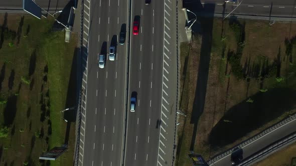 Top View Cars Driving on Highway Road. Car Traffic on Freeway Interchange alt