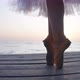 Legs of Ballerina in Pointies and Tutu Dancing on Tiptoes in Sunrays on Wooden Pier - VideoHive Item for Sale