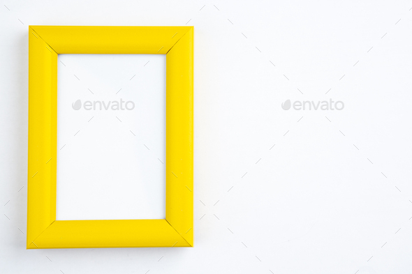 Vertical view of empty yellow picture frame on white background with free space