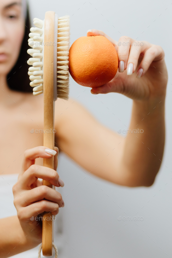 woman using Dry Brush for anti cellulite treatment Stock Photo by  avanti_photo