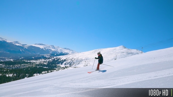 Slow Motion Skier On A Steep Trail Surrounded By The Picturesque Snowy Rocky Mountains By Butlerm