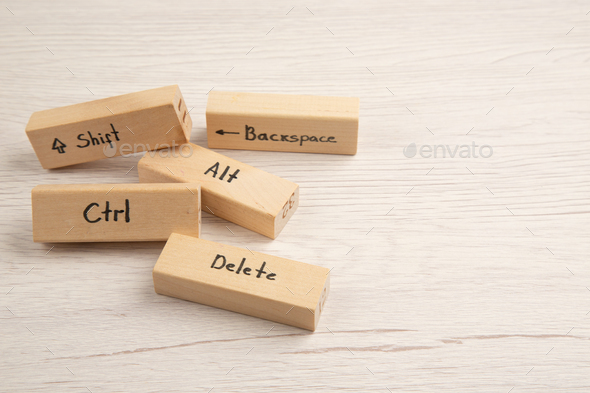 bottom view keyboard icons on wood blocks on wooden table with fee space - Stock Photo - Images