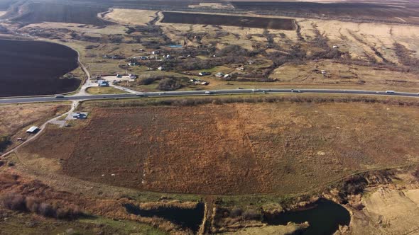 Highway on the Background of Wind Turbines and Blue Sky alt