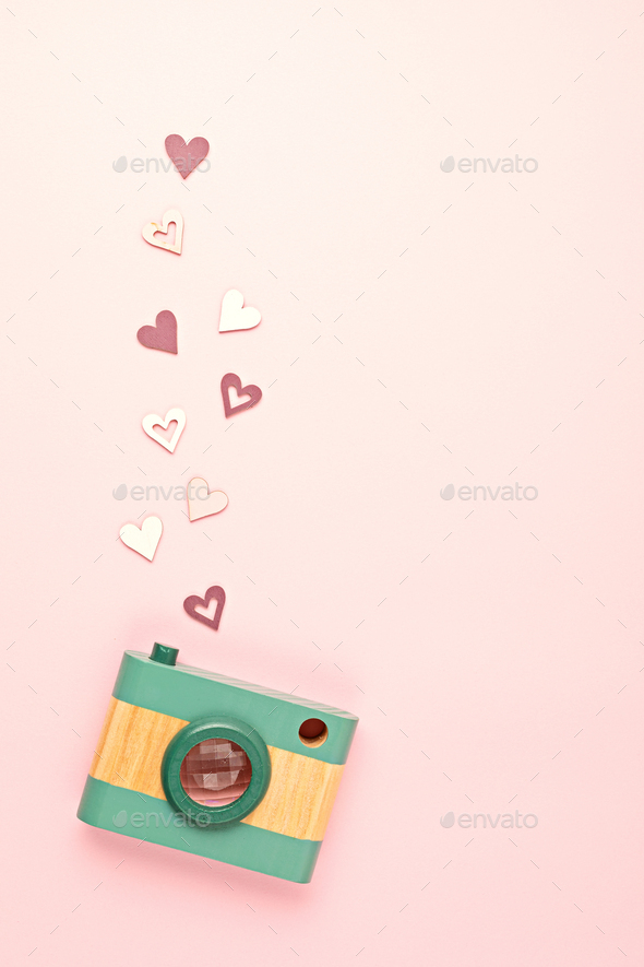 Flat lay with toy wooden camera and hearts. Social media, posts, likes,  followers, online Stock Photo by OksaLy