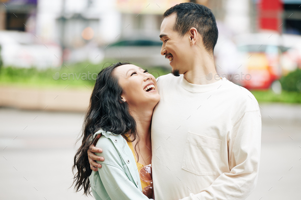 Happy Chinese boyfriend and girlfriend Stock Photo by DragonImages