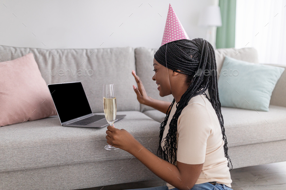 Young african lady having online party from home