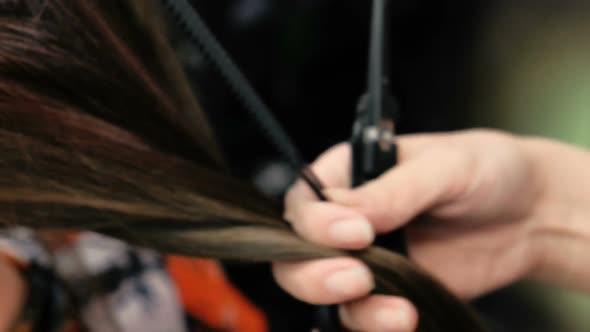 Barber's Hands Cutting Long Brunette Hair Hot Scissors