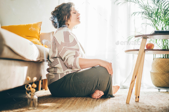 Plus size woman doing yoga and meditation.Plus size woman doing