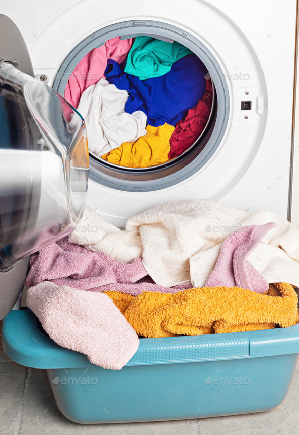 Washing or drying machine loaded with the laundry. Washing, spring cleaning idea