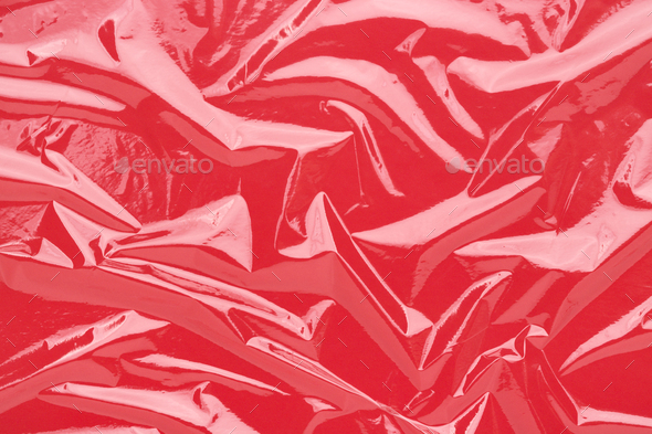 Wrinkled Cling Film Red Vinyl Abstract Background.