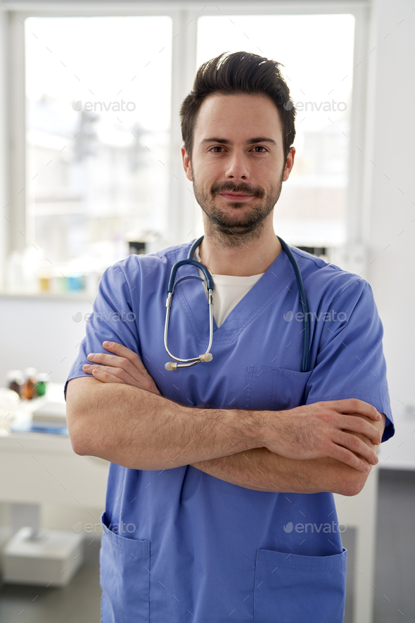 Portrait of young smiling doctor in the doctor\'s office