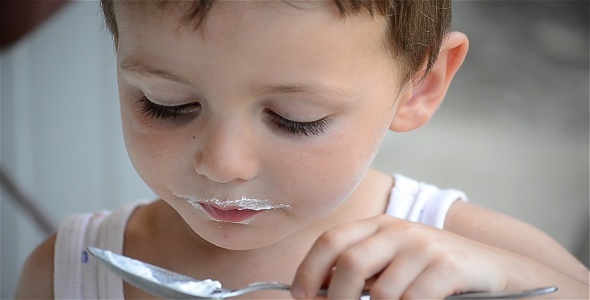 Child Eating Cream