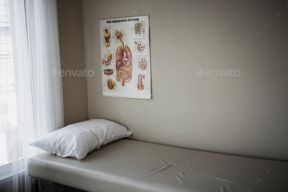 Image of Patient's bed and diagnostic equipment in the hospital emergency department.