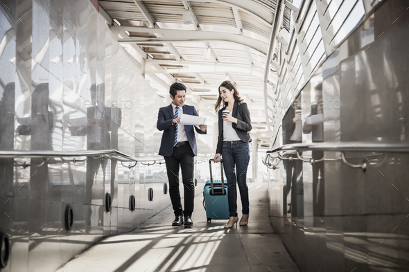 Portrait of two business people meeting before go to traveling. Business travel concept