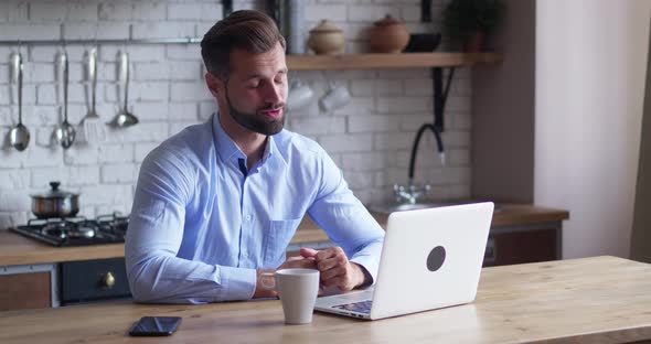 Smiling Businessman Making Conference Video Call on Laptop alt