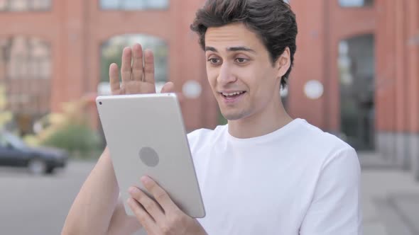 Outdoor Man Doing Video Chat Using Tablet alt