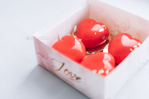 Red heart-shaped cake in a box. Gift for Valentine\'s Day and Women\'s Day