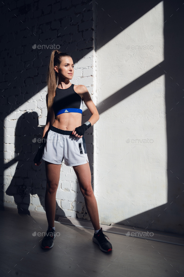 Young Female Runner With Perfect Figure Dressed In Sport Bra And