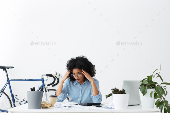 People, business, job, career and deadline concept. Stressed desperate female office worker holding