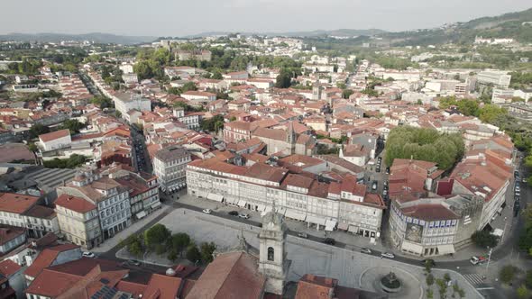 Guimaraes cityscape panorama view from above, Aerial pullback - Portugal