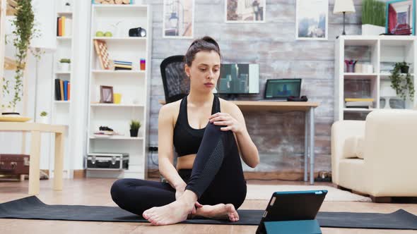 Young Caucasian Woman in Sportswear Practicing Yoga alt