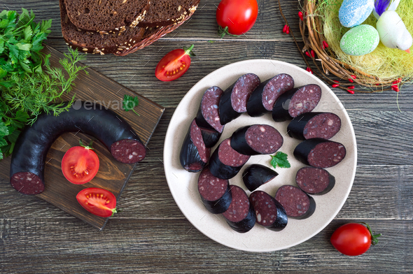 Morsilla - blood sausage. Pieces of Spanish black pudding on a plate. Easter menu.