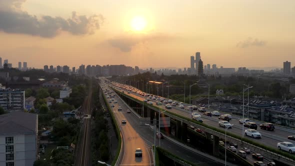 Aerial view of highway and overpass in city alt