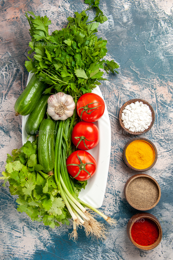 Top View Fresh Green Onion With Vegetables Greens And Seasonings On A Light Blue Background Meal Stock Photo By Kamranaydinovstudio