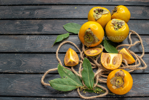 front view fresh sweet persimmons on wooden rustic desk tree fruit mellow