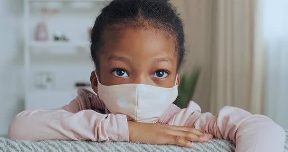 Home Portrait Little Cute Darkskinned Girl Child Sick Kid Wears Face Mask From Coronavirus Infection alt