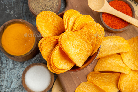 Image of Potato slices are being cut using chips slicer to prepare potato  chips-KM389851-Picxy