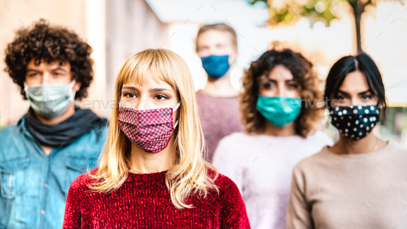Urban crowd of worried citizens walking on city street covered by face mask