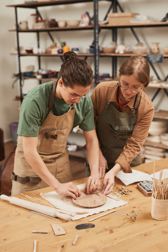 Two Artisans Making Ceramics