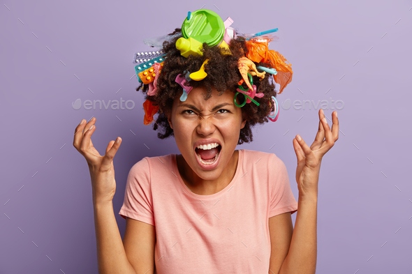 Irritated Dark Skinned Woman Screams Angrily Raises Hands